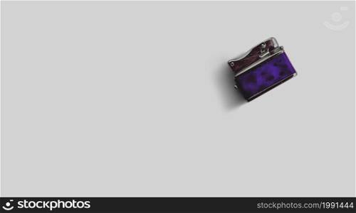 Isolated metallic lighter on grey background , added copy space for text.