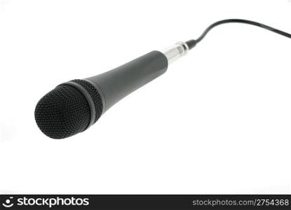 Isolated microphone with cable. The studio musical microphone isolated on a white background