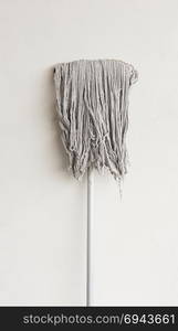 Isolated mop on white background.