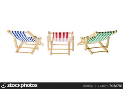 Isolated objects: group of wooden multicolored striped deck chairs, isolated on white background