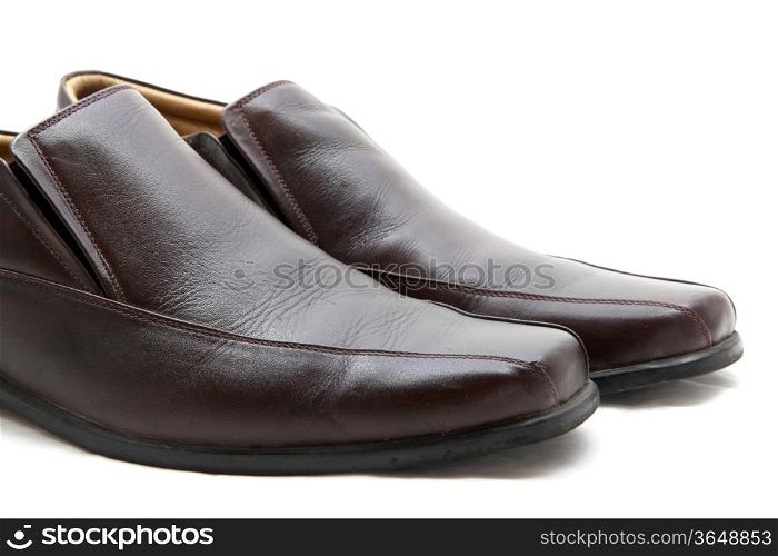 isolated pair of luxury brown leather man shoes on a white background, close up