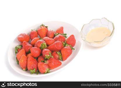 Isolated pile strawberry and yogurt flavor in white dish