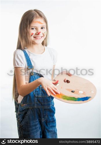 Isolated portrait of cute artist girl with face in paint