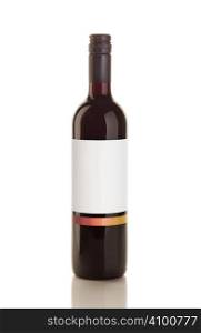 Isolated red wine bottle over a reflective white table