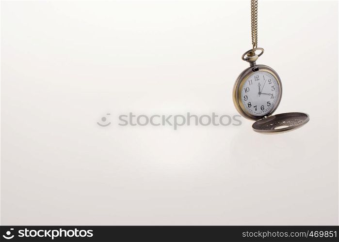 Isolated retro styled pocket watch on white background
