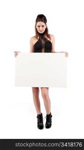 isolated sexy young woman dressed for nightclub holding white sign