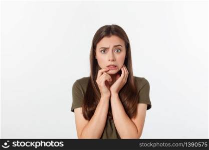 Isolated shot of speechless concerned shocked and angry woman, expressing silence and misconceptions, frightened. Isolated over grey background.. Isolated shot of speechless concerned shocked and angry woman, expressing silence and misconceptions, frightened. Isolated over grey background
