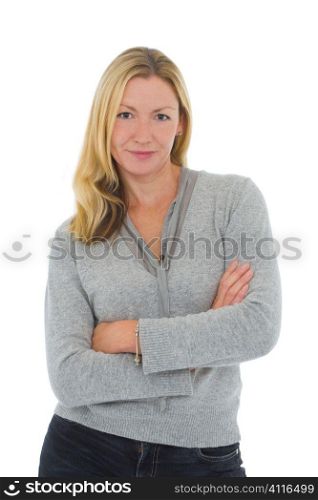 Isolated studio shot of an attractive thirtysomething young woman arms crossed and looking thoughtful