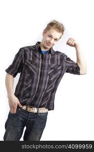 Isolated teen boy posing and pointing finger over white background