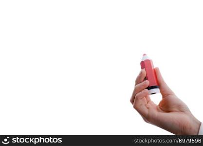 Isolated thick, red pencil in hand on a white background