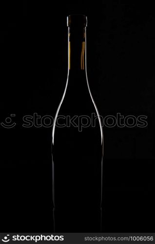 Isolated wine bottle on a black background.. Isolated wine bottle on a black background