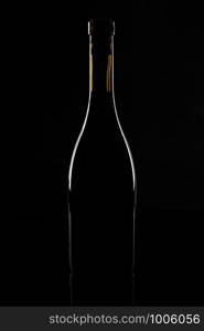 Isolated wine bottle on a black background.. Isolated wine bottle on a black background