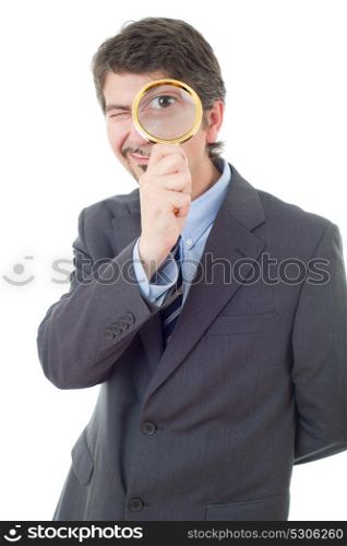 Isolated young business man with magnifying glass