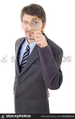 Isolated young business man with magnifying glass