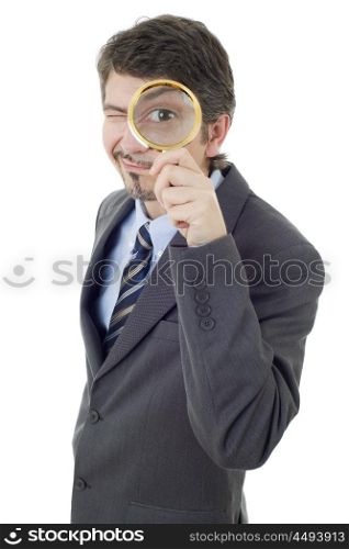 Isolated young business man with magnifying glass, isolated