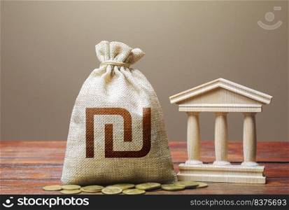 Israeli shekel money bag and bank / government building. Monetary policy. Tax collection and budgeting. GDP and GNP. Support businesses in times of crisis. Lending loans, deposits. State debt.