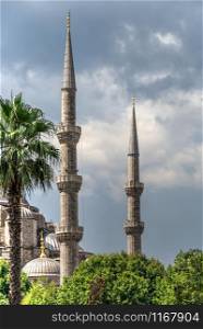 Istambul, Turkey ? 07.12.2019. Minarets of the mosque of Hagia Sophia in Sultan Ahmed Park, Istanbul, Turkey, on a cloudy summer day. Minarets of the mosque of Hagia Sophia in Istanbul, Turkey
