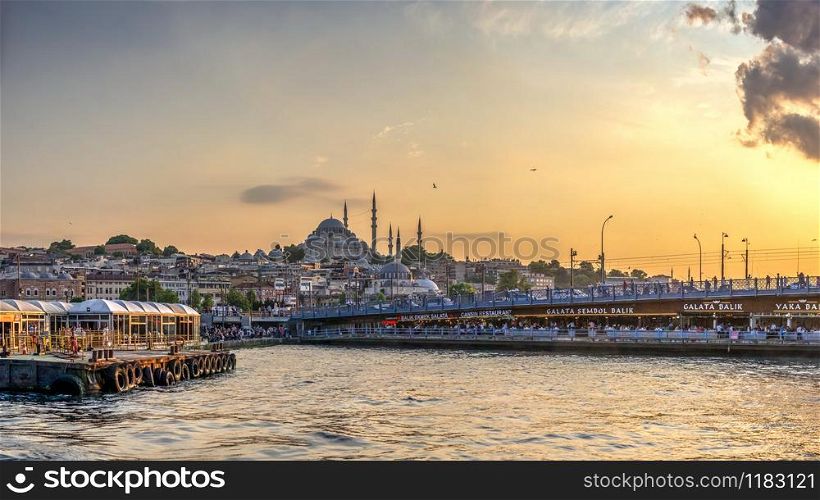 Istambul, Turkey ? 07.12.2019. Panoramic view of Eminonu Square, Galata Bridge, Galata Tower and New Mosque in istanbul on a sunny summer evening. Eminonu square and Galata bridge in Istanbul, Turkey