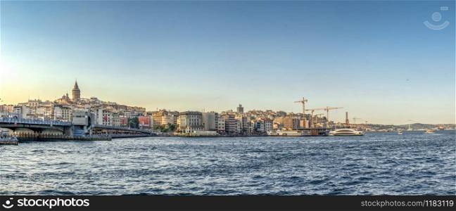 Istambul, Turkey ? 07.12.2019. Panoramic view of Galata Bridge and Galata Tower in istanbul on a sunny summer evening. Galata bridge in Istanbul, Turkey