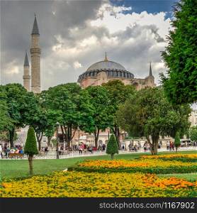 Istambul, Turkey ? 07.12.2019. The Sultan Ahmad Maydan water fountain with the Hagia Sophia museum in background on a cloudy summer day, Istanbul, Turkey. The Sultan Ahmad Maydan in Istanbul, Turkey