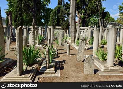ISTANBUL, TURKEY - JULY 15: Gravestones in the graveyard of Suleymaniye Mosque, 15 July 2014 in Istanbul Turkey. Suleymaniye cemetery Suleiman the Magnificent is a cemetery where the tomb.