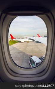 ISTANBUL, TURKEY - MARCH 12, 2016: view of the takeoff field through the porthole at Ataturk Airport. Istanbul, TURKEY, March 12, 2016