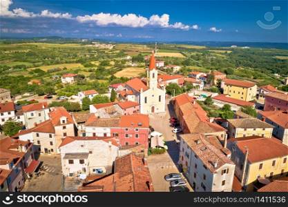 Istria. Town of Brtonigla on green istrian hill aerial view, Istria region of Croatia