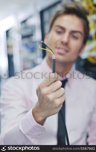 it business man in network server room have problems and looking for disaster situation solution