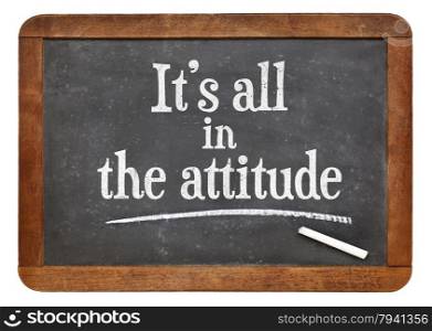 It is all in the attitude - motivational phrase on a vintage slate blackboard