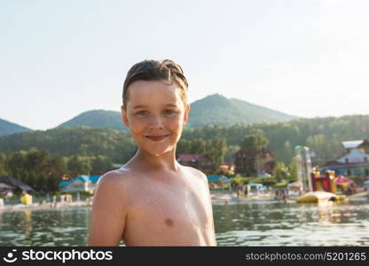 It is summertime. Baby boy at the beach