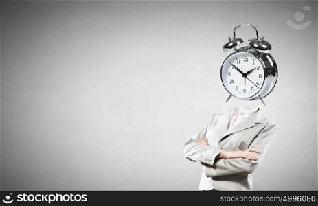 It&rsquo;s high time. Businesswoman with alarm clock instead of her head