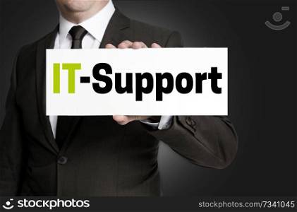 IT support sign is held by businessman concept.. IT support sign is held by businessman concept