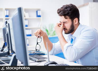 IT technician looking at IT equipment