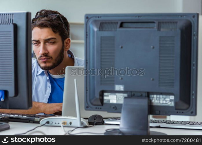 IT technician looking at IT equipment