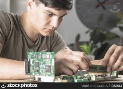 it technician students inserting ram computer motherboard