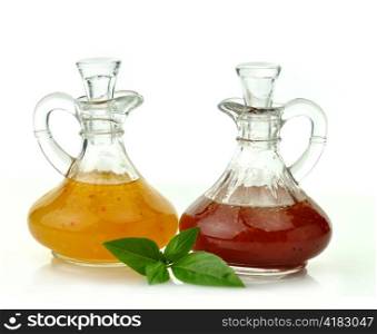 italian and raspberry vinaigrette salad dressings in glass bottles