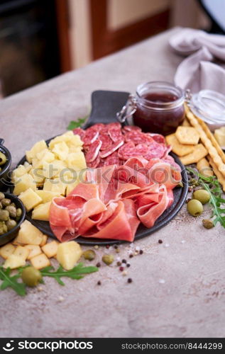 Italian antipasto meat platter - prosciutto ham, bresaola, salami and parmesan.. Italian antipasto meat platter - prosciutto ham, bresaola, salami and parmesan