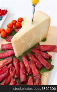 Italian appetizer with bresaola and parmesan cheese