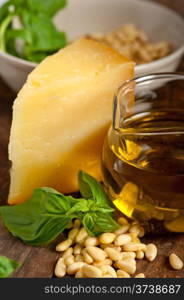 Italian basil pesto ingredients over old wood macro