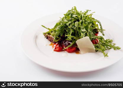 Italian beef tagliata salad with wild rocket, cherry tomatoes and parmesan cheese