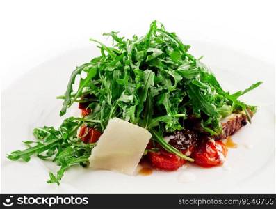 Italian beef tagliata salad with wild rocket, cherry tomatoes and parmesan cheese