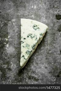 Italian blue cheese. On the stone table.. Italian blue cheese.