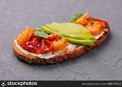 Italian bruschetta with shrimp and avocado and tomatoes