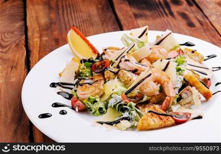 Italian Caesar salad with shrimp, croutons and parmesan