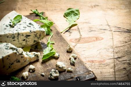 Italian cheese and herbs on the Board.. Italian cheese and herbs on Board.