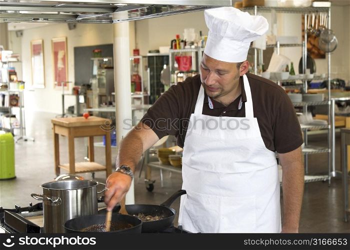 Italian chef preparing a pasta meal in the kitchen