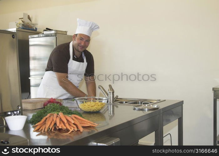 italian chef washing his hands prior to preparing the diner