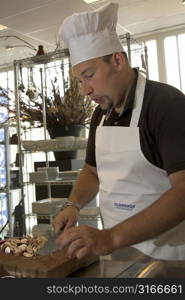 Italian chef whistling a tune while chopping the mushrooms