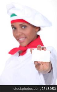 Italian chef with a blank business card