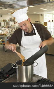 Italian chef working in the restaurant kitchen